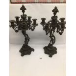 A PAIR OF BRONZE ROCOCO FRENCH FIVE BRANCH 19TH CENTURY CANDELABRAS DECORATED WITH VINE LEAVES AND
