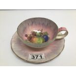 A CLARICE CLIFF HAND PAINTED DUO TEACUP AND SAUCER