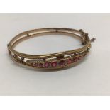 A HM 9CT ROSE GOLD BANGLE SET W/PINK TOURMALINES & DIAMOND CHIPS (TWO MISSING) ONE STONE REPLACED