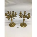 A PAIR OF SMALL BRASS SIX ARMED CANDLEABRAS, 24CM TALL