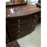 A BOW FRONTED TWO OVER THREE CHEST OF DRAWERS