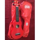 TWO MAHALO UKULELES ONE RED OTHER BLACK WITH RED CASES