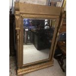 A VICTORIAN GILDED BEVELLED MIRROR WITH SIDE COLUMN 129 X 81CM