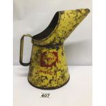 A VINTAGE METAL SHELL YELLOW OIL CAN