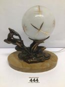 AN ART DECO LAMP ON MARBLE BASE DECORATED WITH A METAL DEER