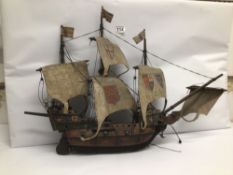 A LARGE WOODEN MODEL OF A PIRATE SHIP 66 X 50CM