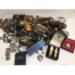 A LARGE MIXED COLLECTION OF COSTUME JEWELLERY MOST OF WHICH ARE NECKLACES (SOME FAUX PEARLS) AND