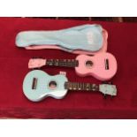 TWO CASED MAHALO UKELELES PINK AND GREEN