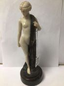 A REPRODUCTION BRONZE FIGURE MARKED F PRIESS OF A PARTLY ROBED WOMAN, 22CM