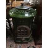 A BELGIUM ENAMEL GREEN STOVE BY FONDERIES NESTOR MARTIN, 82CM IN HEIGHT