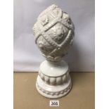 A GLAZED WHITE PORCELAIN STATUE OF AN ACORN WITH NUMBERED MARKINGS TO BASE 297/10023, APPROX 38CM IN