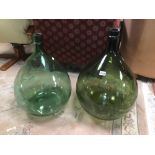 TWO LARGE GREEN GLASS CARBOUYS 68CM HIGH