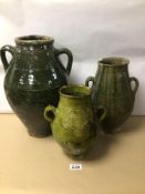 THREE ISLAMIC GREEN GLAZED WATER JARS 19TH CENTURY, LARGEST 40CM