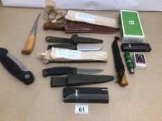 A COLLECTION OF KNIVES AND DAGGERS MOSTLY OF NORDIC MAKERS INCLUDING MARTINI AND MORE, MOST OF WHICH