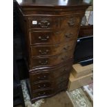 A VINTAGE FLAME MAHOGANY SERPENTINE CHEST ON CHEST OF DRAWERS WITH SLIDE 155 X 72 X 45CM