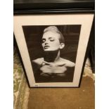 A FRAMED AND GLAZED BLACK AND WHITE PHOTOGRAPH 62 X 43CM