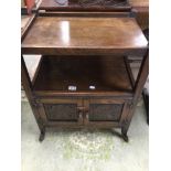 A VINTAGE OAK TEA TROLLEY WITH CUPBOARD