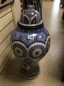 A LARGE CERAMIC HANDCRAFTED GLAZED LIDDED URN WITH A MOORISH PATTERN BLUE MOROCCAN, WITH MARKS TO
