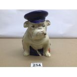 AN EARLY ROYAL DOULTON RARE BULLDOG SEATED DRAPED IN UNION JACK WITH A SAILORS HAT AND CIGAR, 19CM