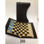 A VINTAGE TRAVELLING CHESS & DRAUGHTS SET, ONE PIECE MISSING
