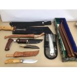 A MIXED COLLECTION OF SHEATHED DAGGERS AND BLADES, INCLUDES A MARTINDALE NO 2 MACHETE, A