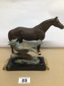 A VINTAGE PAINTED CAST IRON HORSE, TOGETHER WITH AN ART DECO SPELTER FIGURE OF A BIRD, LARGEST IS