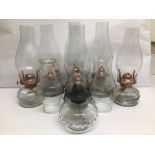 A COLLECTION OF SEVEN VINTAGE COPPER AND GLASS MINI OIL LAMPS, TALLEST IS APPROX 31CM