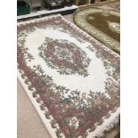 A LARGE WOOL RUG MADE IN INDIA 284 X 182CM