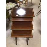 A VINTAGE MAHOGANY NEST OF FOUR TABLES, LARGEST BEING 69 X 53 X 35CM