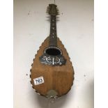 A VINTAGE WOOD AND MOTHER OF PEARL MANDOLIN