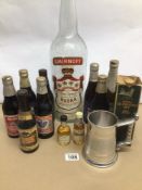 A LARGE EARLY VINTAGE EMPTY SMIRNOFF THREE LITRE VODKA BOTTLE TOGETHER WITH A SMALL COLLECTION OF