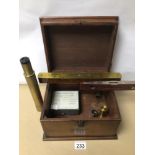 A VINTAGE BOX WITH TELESCOPE, LENSES AND MORE