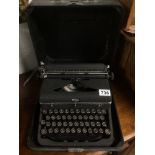 A BLACK VINTAGE ROYAL TYPEWRITER CASED