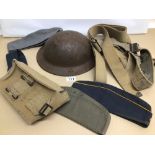 A COLLECTION OF MILITARY HATS, A METAL HELMET, BELTS, AND AN AMMO POUCH