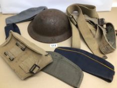 A COLLECTION OF MILITARY HATS, A METAL HELMET, BELTS, AND AN AMMO POUCH