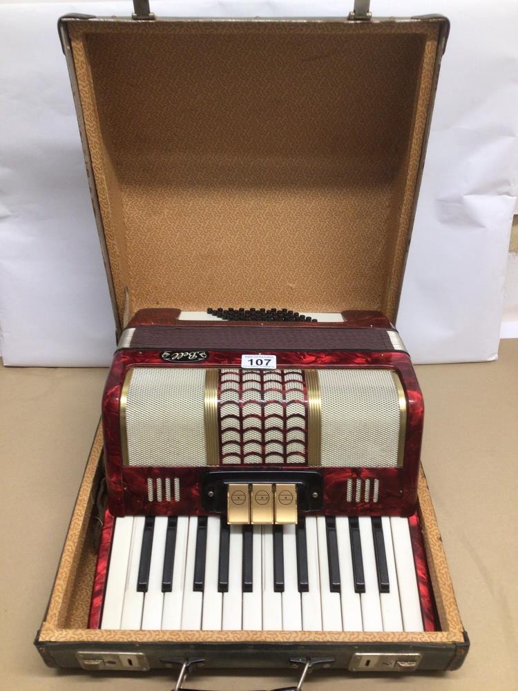 A CASED BELL FORTY-EIGHT BASS THREE COUPLER PIANO ACCORDION