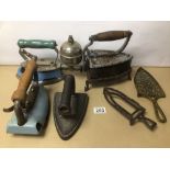 A COLLECTION OF VINTAGE IRONS AND TRIVETS, INCLUDES CAST IRON AND BRASS