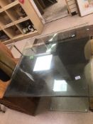 AN UNUSUAL TEMPERED GLASS SWIVEL TABLE WITH CHROME ENCLOSED 90 X 90 X 76CM