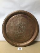 A VINTAGE COPPER TRAY WITH ENGRAVING OF JOHNNIE WALKER, 34CM