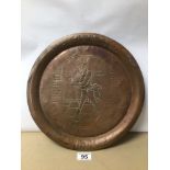 A VINTAGE COPPER TRAY WITH ENGRAVING OF JOHNNIE WALKER, 34CM