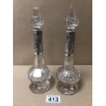 A PAIR OF CUT GLASS PERFUME DECANTER WITH SILVER COLLARS (MARKED RUBBED) A/F, 24CM