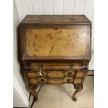 AN EARLY WALNUT WRITING BUREAU WITH COMPARTMENTS