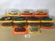 A COLLECTION OF VINTAGE DIE - CAST PILEN MODEL TOY CARS WITH MOST IN PLASTIC DISPLAY CASES