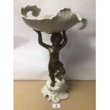 AN ART DECO PORCELAIN FRUIT BOWL WITH BRONZE CHERUB 29CM X 46CM