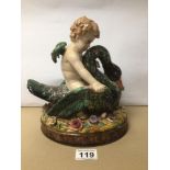 A MAJOLICA FIGURE OF AN ANGEL RIDING A SWAN A/F 20CM X 24CM