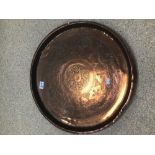 A LARGE ENGRAVED COPPER TRAY, 52CM DIAMETER
