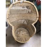 A VINTAGE PEACOCK CHAIR MADE FROM WICKER