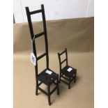 TWO CAST IRON MINIATURE LADDER BACK CHAIRS LARGEST BEING 38CM IN HEIGHT
