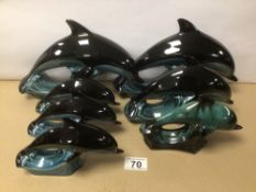 SIX POOLE POTTERY FIGURINES OF DOLPHINS AND ONE OTHER UNMARKED