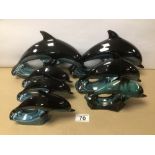 SIX POOLE POTTERY FIGURINES OF DOLPHINS AND ONE OTHER UNMARKED